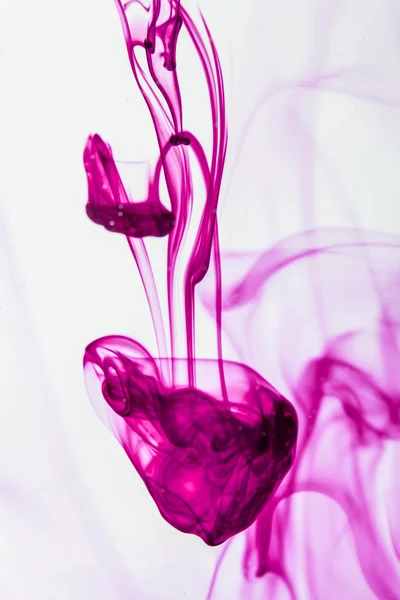 Blue and violet liquid in water making abstract forms — Stock Photo, Image