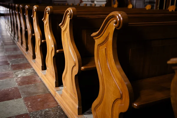 Rows of wooden church benches without anybody from close — Stock Photo, Image