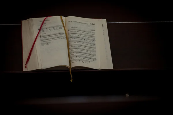 Bible on a church bench — Stock Photo, Image