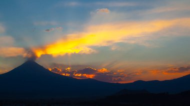 View on th Popocatepetl Volcano during sunset from the ancient pyramid of Cholula, Mexico