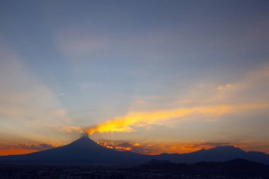 View on th Popocatepetl Volcano during sunset from the ancient pyramid of Cholula, Mexico