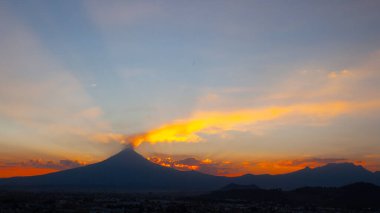 View on th Popocatepetl Volcano during sunset from the ancient pyramid of Cholula, Mexico