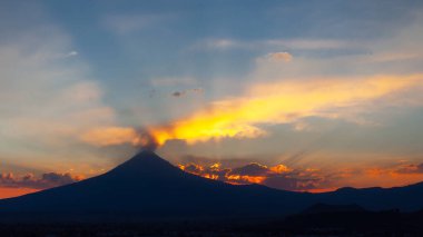 View on th Popocatepetl Volcano during sunset from the ancient pyramid of Cholula, Mexico