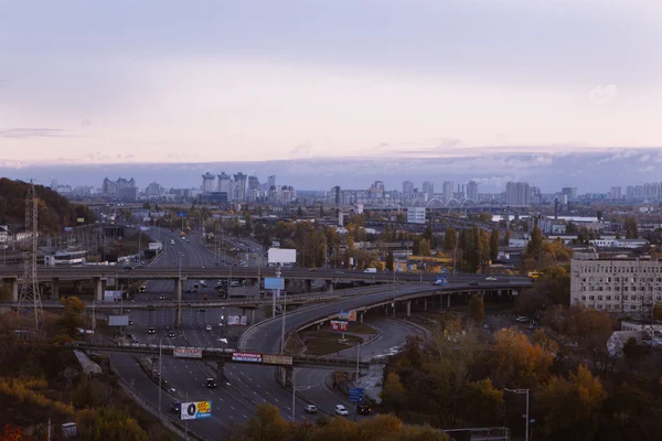 Kiev cityscape: view of industrial part of the city on sunset time on october — Stock Photo, Image