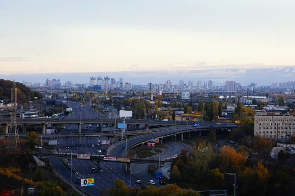 Kiev cityscape: view of industrial part of the city on sunset time on october — Stock Photo, Image