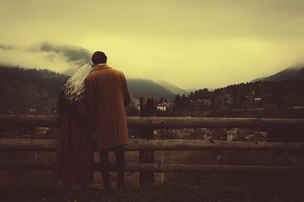 Lovely couple in the autumn mountains