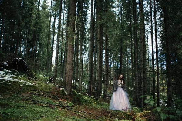 Portrait of romantic woman in beautiful dress in forest — Stock Photo, Image
