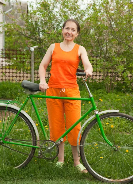 adult  woman near bicycle in the countryside