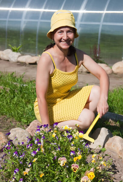 Happy Woman in Summer Herb Garden