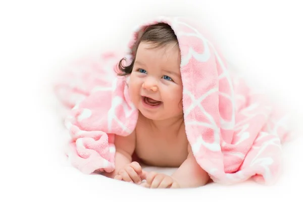 Beautiful little girl under towel — Stockfoto