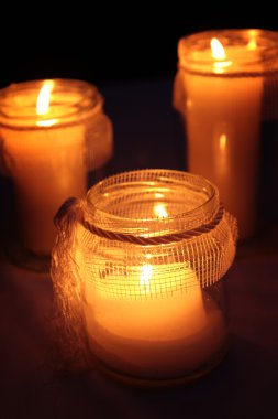 Candles Burning At a Cemetery During All Saints Day clipart
