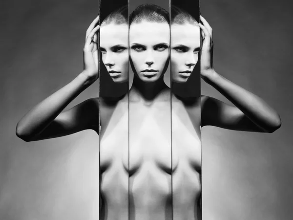 Woman and mirrors — Stock Photo, Image