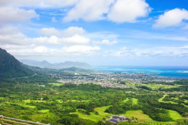 Beautiful view of Kaneohe as seen from high above on Pali Lookout towards the ocean  clipart
