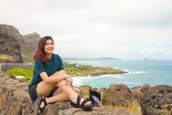 Biracial Asian Caucasian Teen Girl Sitting Top Rock Stone Wall — Stock Photo, Image