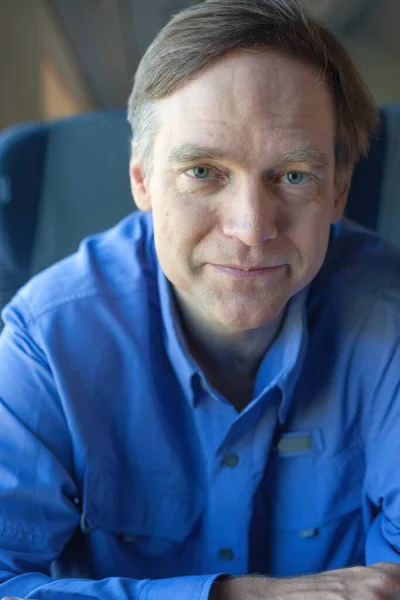 Caucasian Man Forties Blue Shirt Commuter Train Smiling Sitting Forward — Stock Photo, Image