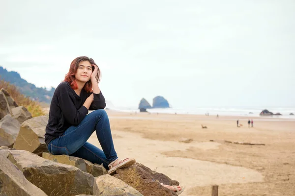 Biracial Teen Girl Sitting Rocky Shore Ocean Pacific Northwest Foggy — Stock Photo, Image