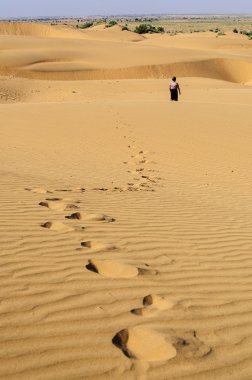 Footprints of a young boy on Sand dunes, SAM dunes of Thar Deser clipart