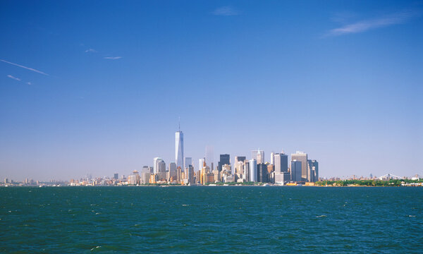 View of the Manhattan Island on a sunny day from the Staten Island Ferry.