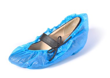 Women's shoe in shoe covers. clipart