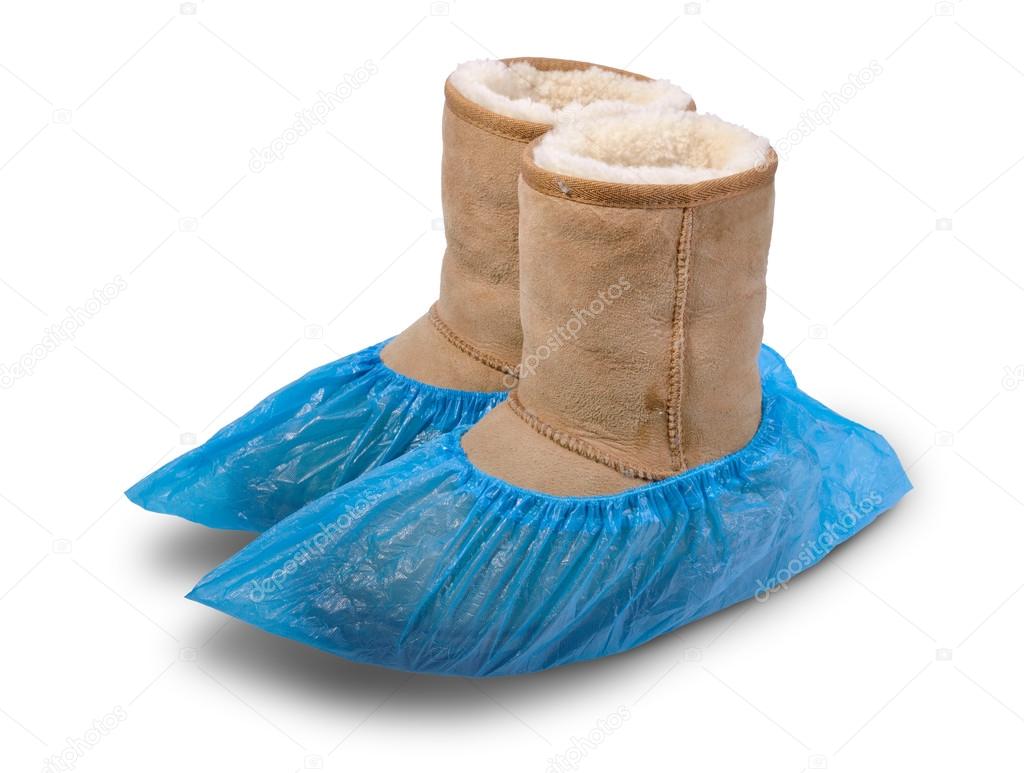 Women's shoe in shoe covers. — Stock Photo © mshch1 67798895
