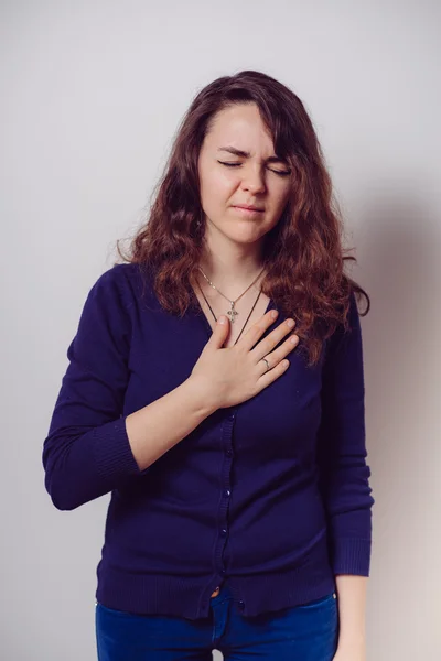 Een vrouw met een hartaanval — Stockfoto