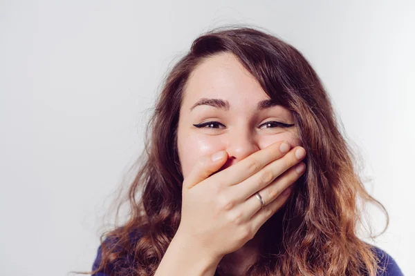 Girl laughs and covers her mouth — Stock Photo, Image