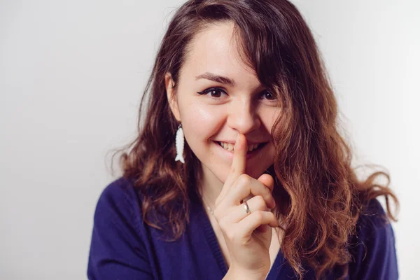 Woman put finger on her lips — Stock Photo, Image