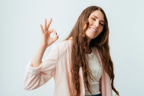 Girl shows OK gesture — Stock Photo, Image