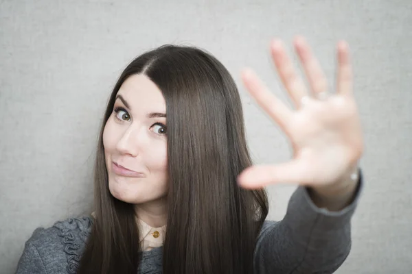 Young woman waving — Stock Photo, Image