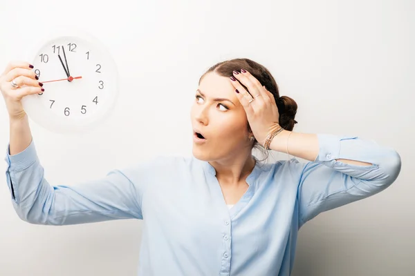 Woman holding clock — Stock Photo, Image