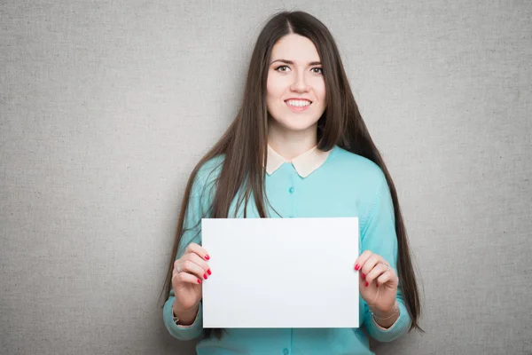 Girl holding white blank paper — Stock Photo, Image