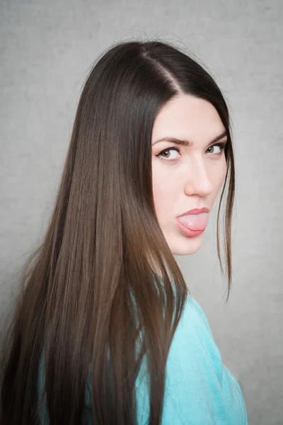 Chica sacando su lengua —  Fotos de Stock