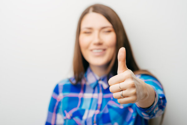 girl showing thumb up