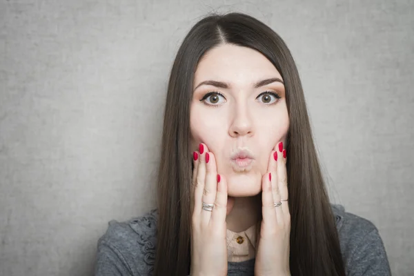 Woman with hands on cheeks — Stock Photo, Image