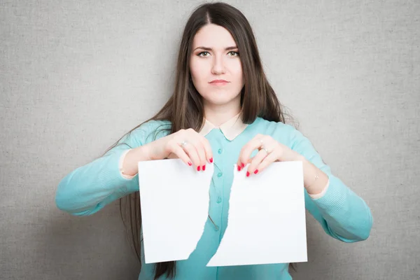 Woman tearing up paper — Stock Photo, Image
