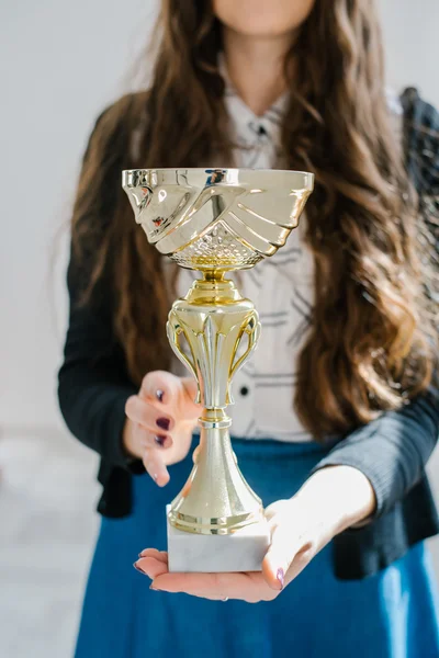 Prize cup in hands — Stock Photo, Image