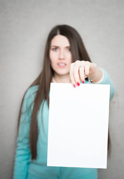 Girl holding white blank paper — Stock Photo, Image