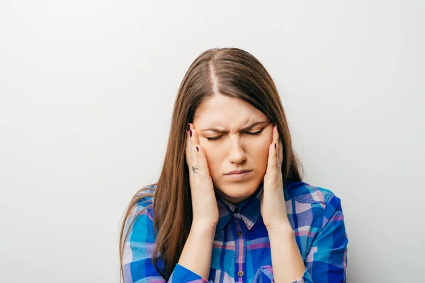 Young woman with a headache — Stock Photo, Image