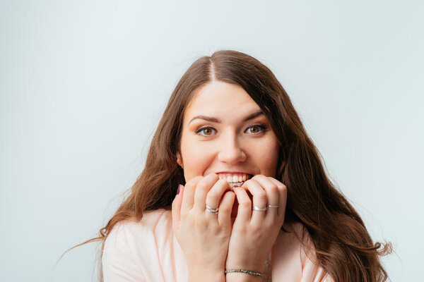 Woman biting her nails