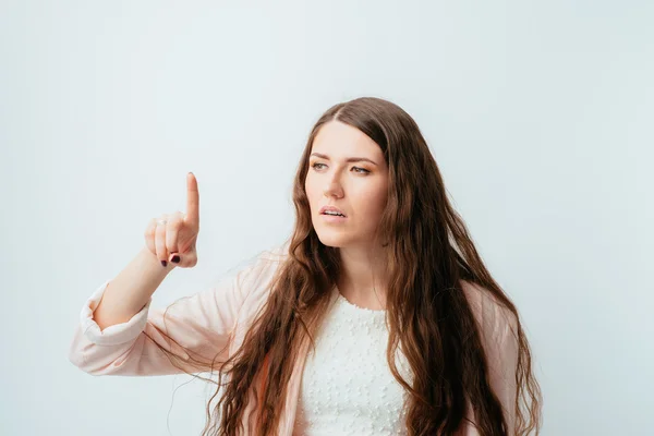 Young woman pointing — Stock Photo, Image