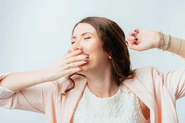 Woman stretches and yawns — Stock Photo, Image