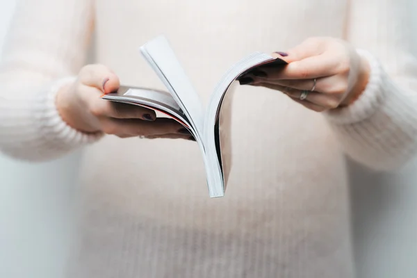 Magazine in female hands — Stock Photo, Image