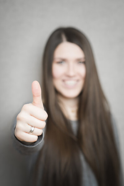woman showing thumb up