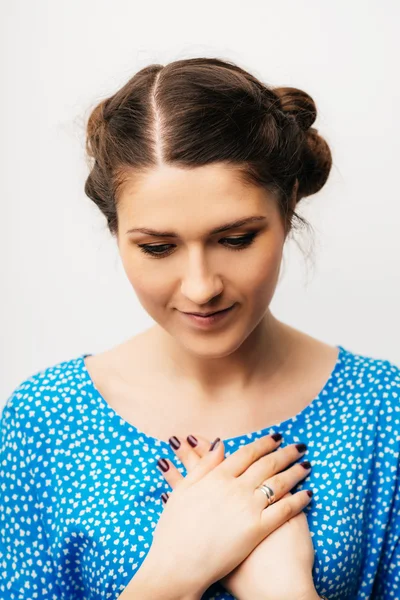 Woman with her hands on her chest — Stock Photo, Image