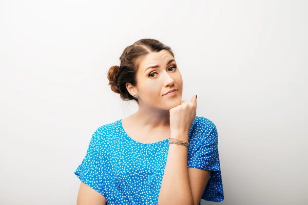 Girl props with fist her chin — Stock Photo, Image