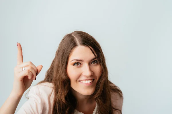 Girl shows herfinger up — Stock Photo, Image