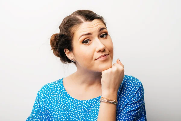 Girl props with fist her chin — Stock Photo, Image