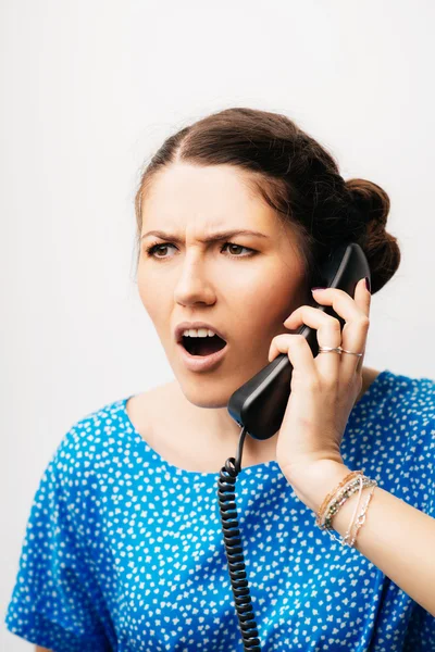 Girl screaming on the phone Stock Picture