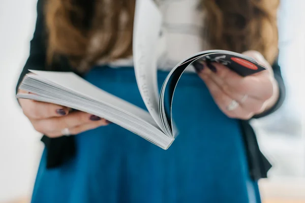 Magazine in female hands — Stock Photo, Image