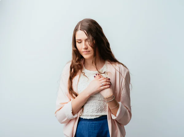 Girl with hands on heart — Stock Photo, Image